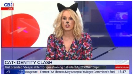 Still of Michelle Dewberry on GB News; a white, blonde woman with cat ears and cat face paint sits in front of an abstract background.