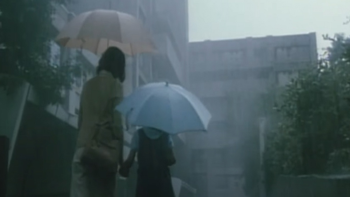 Characters in the rain in Dark Water.