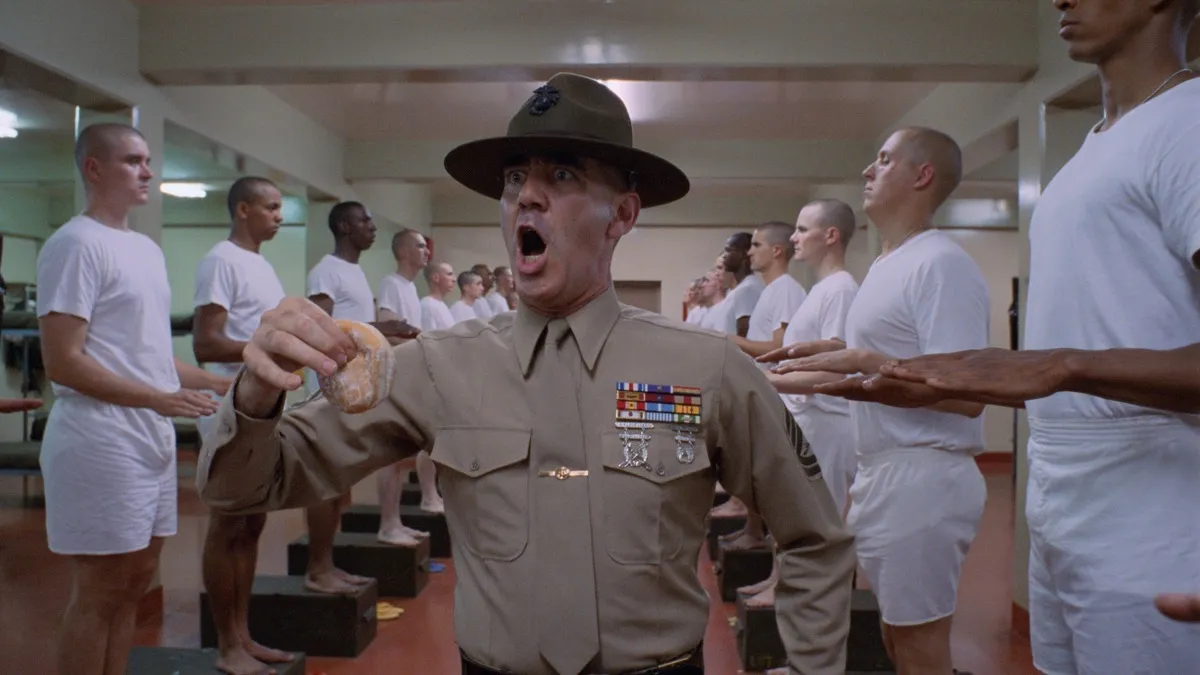 A drill sergeant screams at a line of recruits in "Full Metal Jacket"