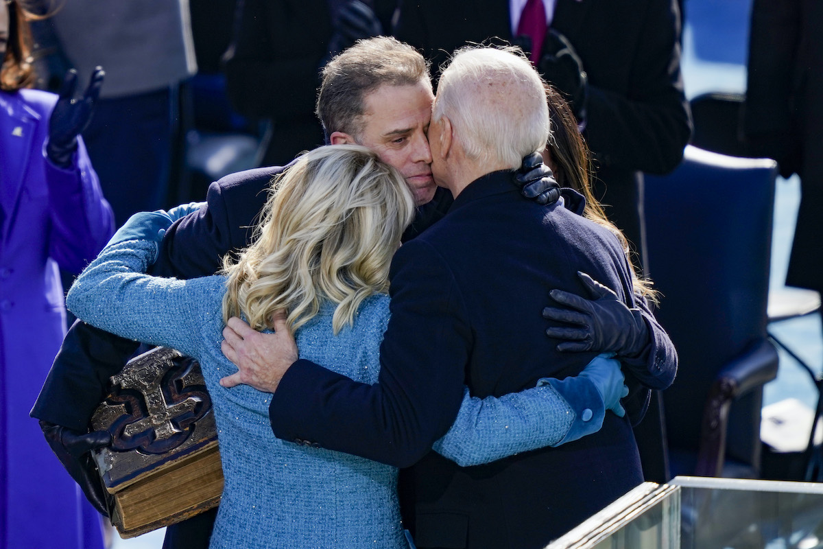 Hunter Biden hugs Joe and Jill Biden.