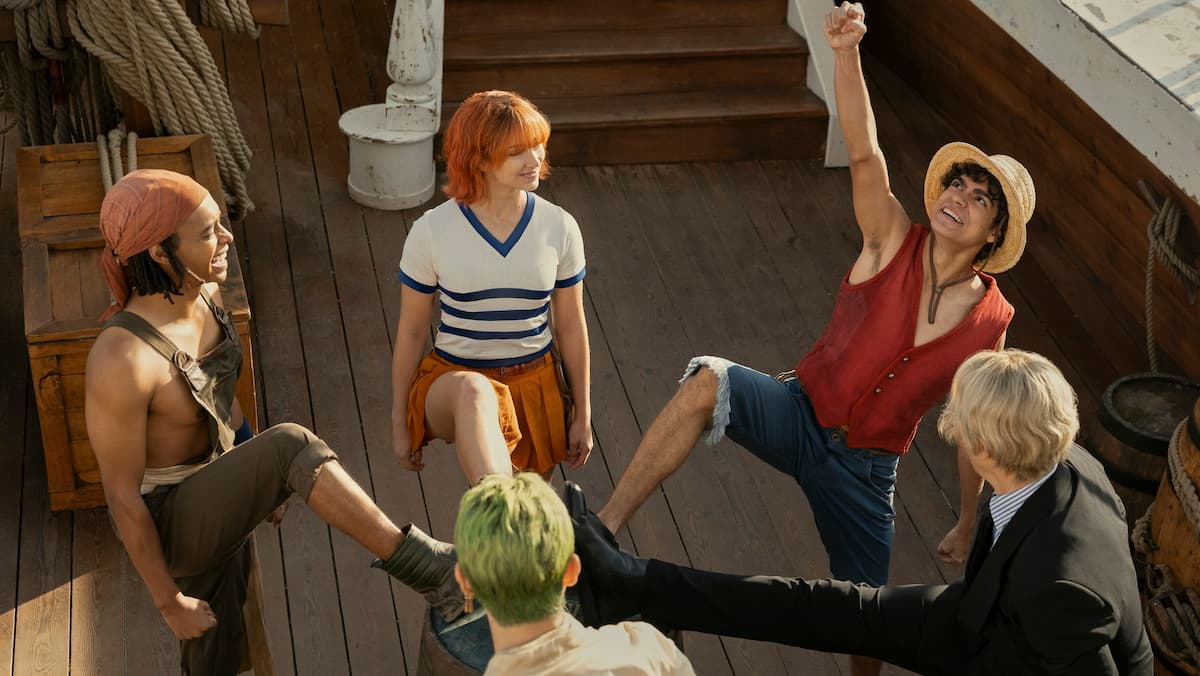 The iconic "feet on the barrel scene" with Luffy, Zoro, Nami, Usopp, and Sanji from Netflix's live action One Piece