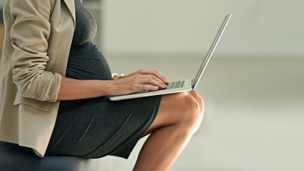 Cropped shot of a pregnant businesswoman using a laptop