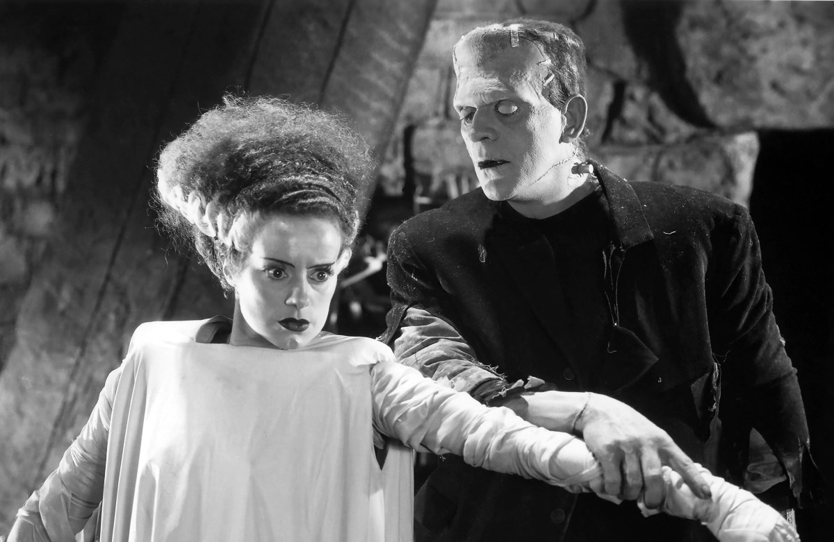 A lusty Frankenstein's monster feels up the arm of his spaced-out bride in "Bride of Frankenstein" 