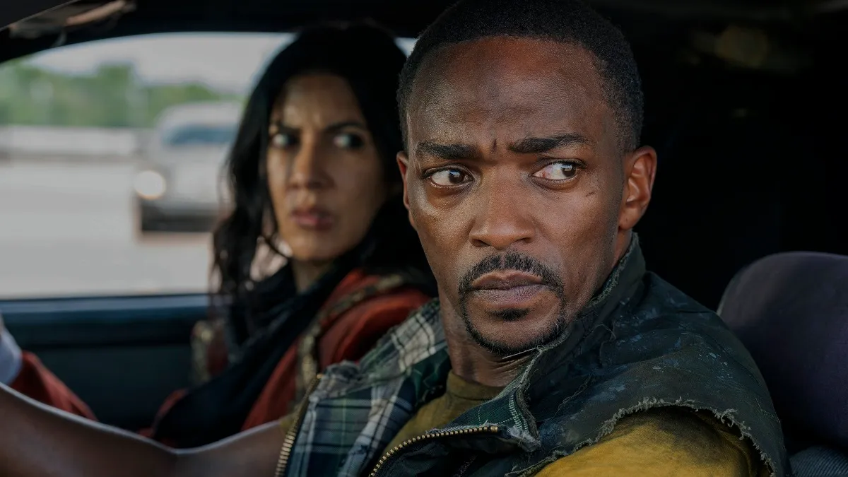 Quiet (Stephanie Beatriz) and John (Anthony Mackie) sit in a car in the Peacock series 'Twisted Metal'