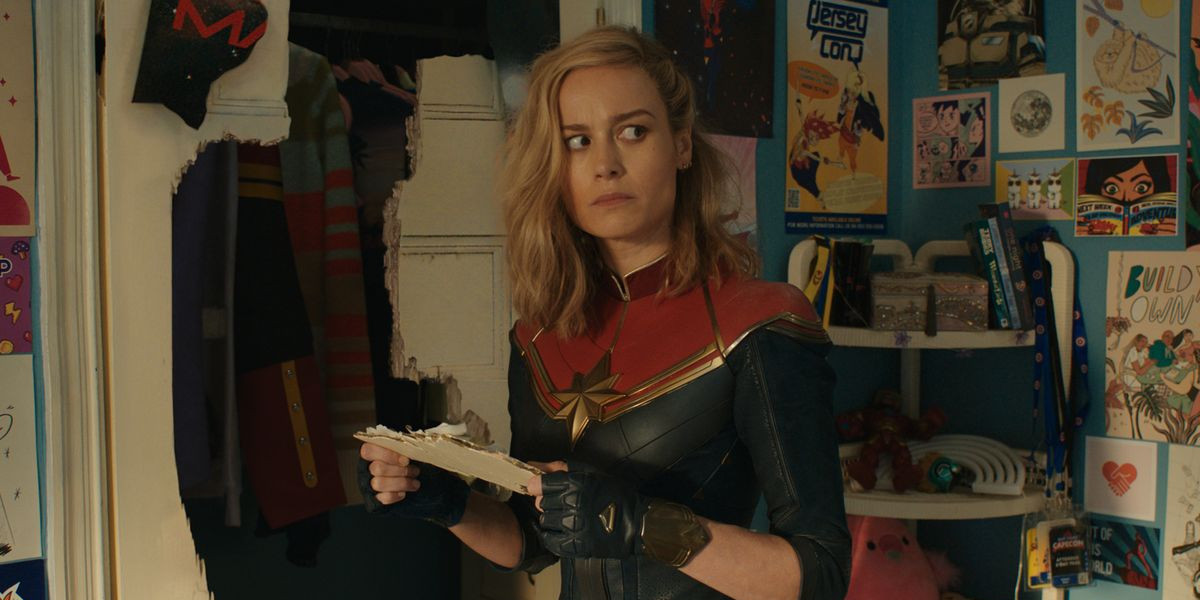 Brie Larson as Captain Marvel, holding a piece of paper and looking confused in Ms. Marvel's post-credits scene