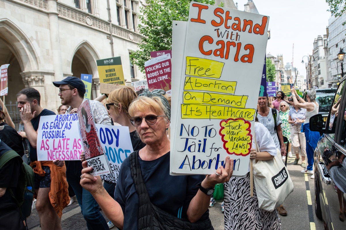 Abortion rights campaigners march from The Royal Court of Justice to Downing Street
