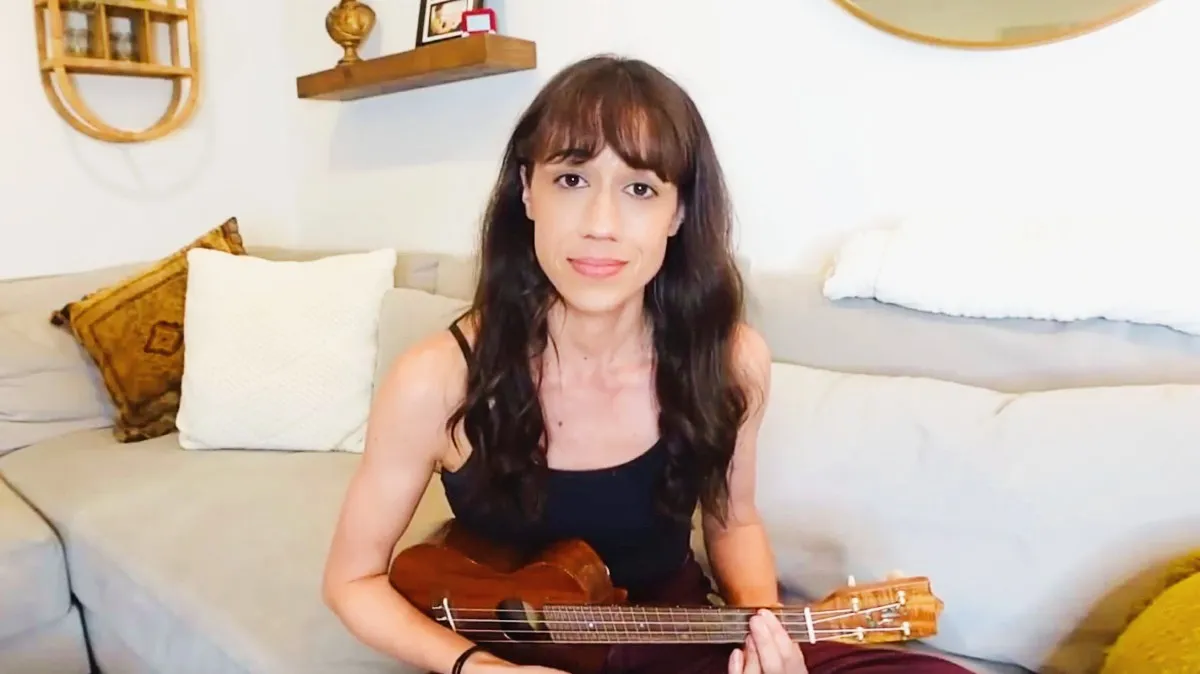 Colleen Ballinger playing a Ukulele on her channel Colleen Vlogs