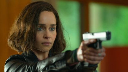 Emilia Clarke as G'iah holding and pointing a gun in Secret Invasion