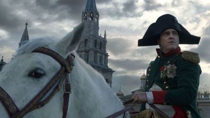 Joaquin Phoenix as Napoleon Bonaparte on a horse in 'Napoleon.'