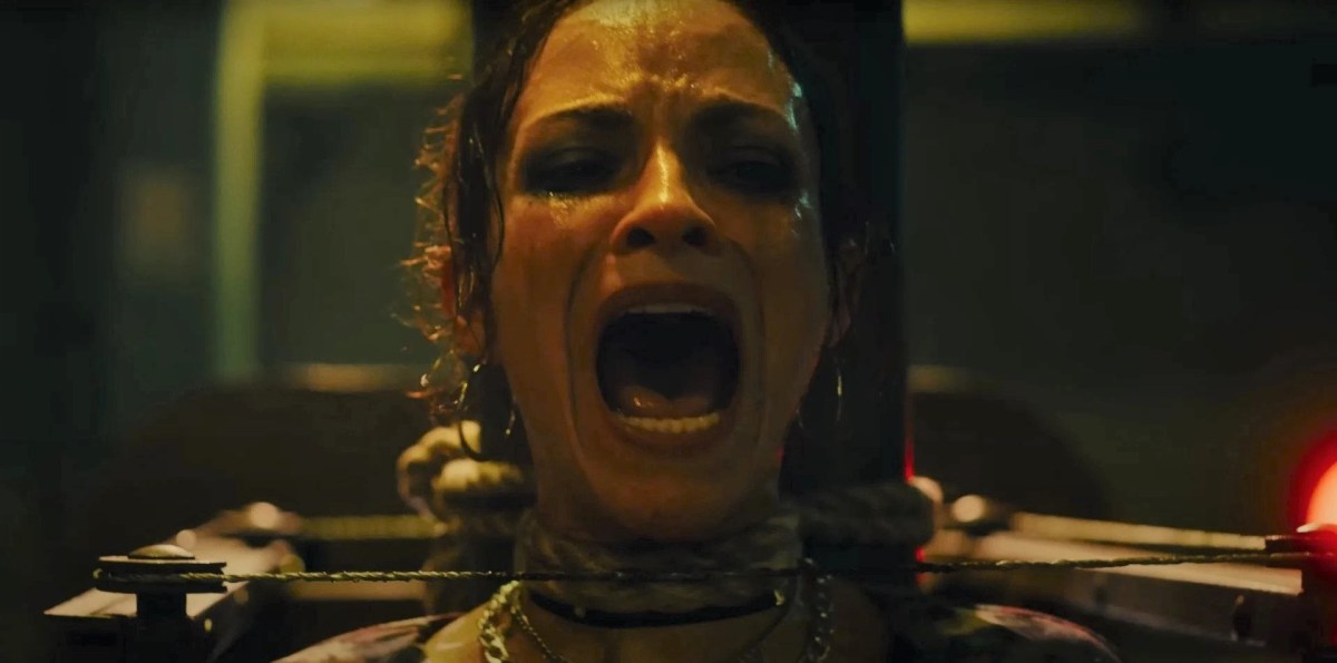 Woman screaming in a trap in Saw X
