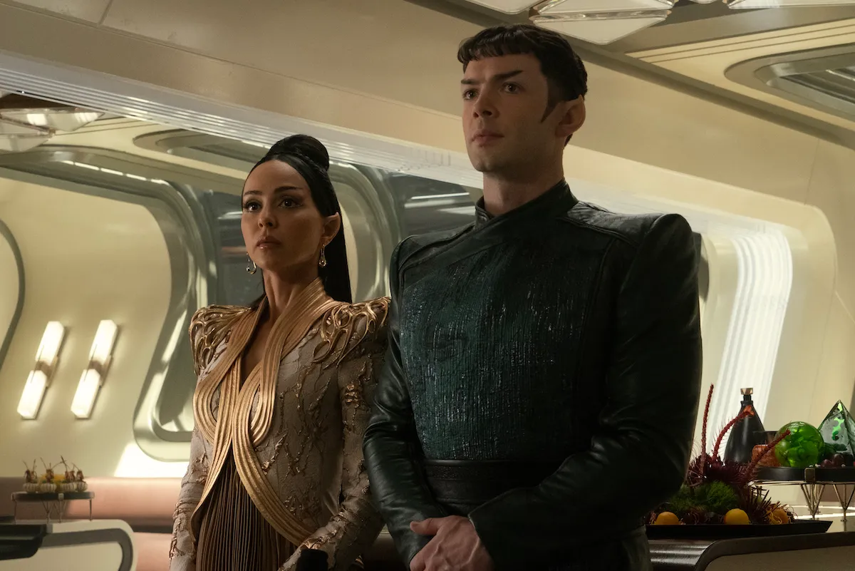 T'Pring and Spock stand side by side, wearing fancy Vulcan ceremonial outfits.