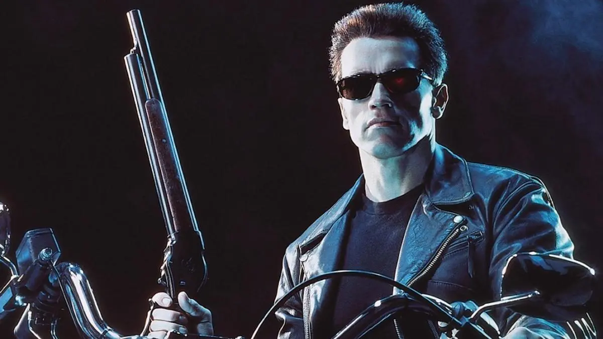 The robotic terminator wearing sunglasses while holding a shotgun in "Terminator 2: Judgement Day"