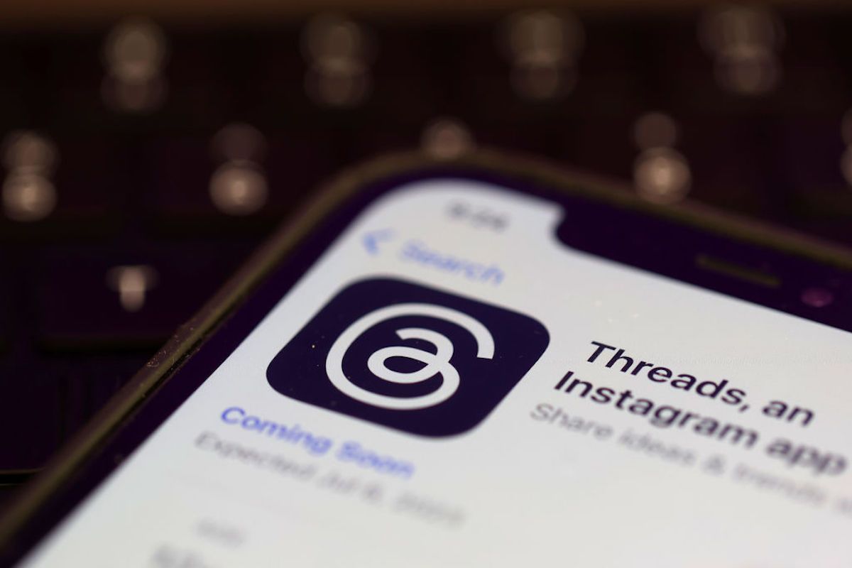 A photo illustration shows the Threads app in the app store on a cell phone