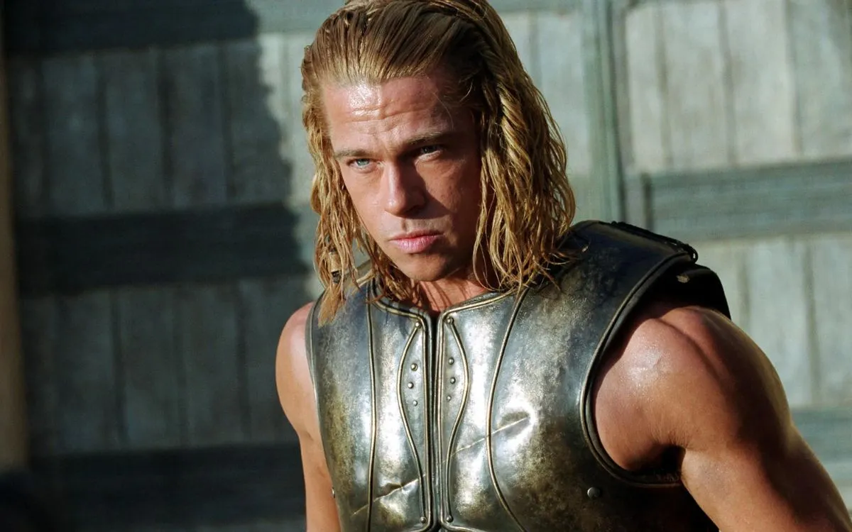A man in armor stands staring at the camera in "Troy"