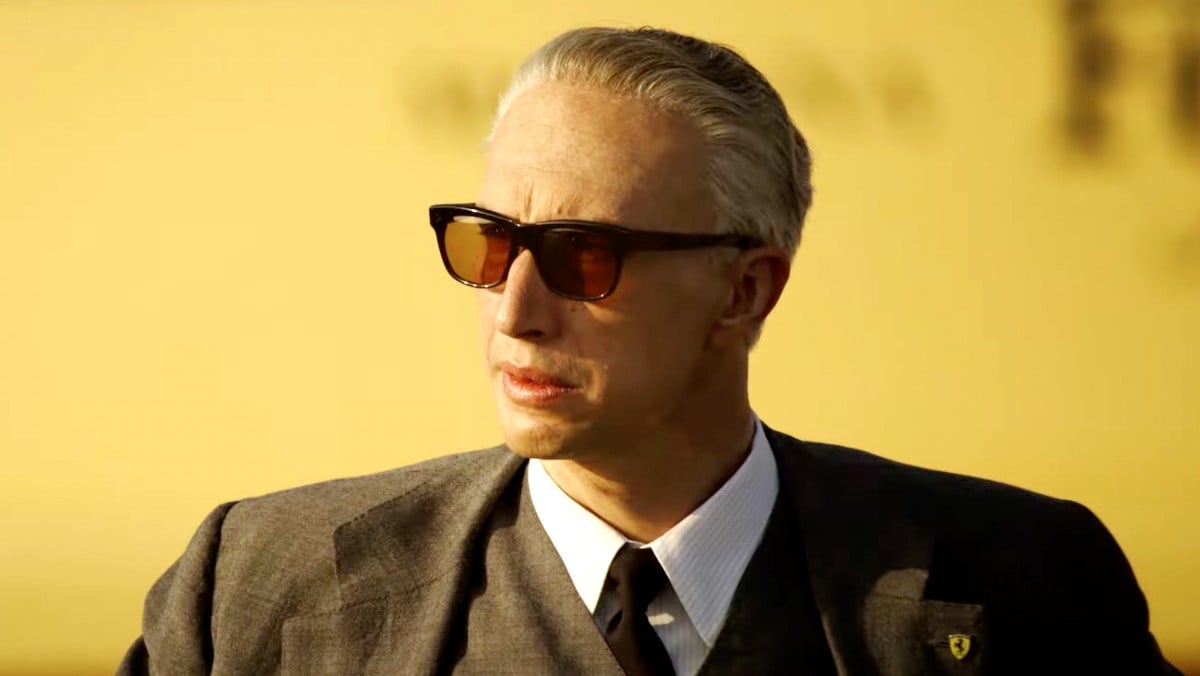 An older white man in a suit and large sunglasses stares into the distance in "Ferrari"