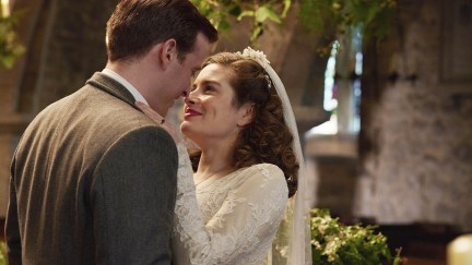 Nicholas Ralph as James Herriot and Rachel Shenton as Helen Aldersen in All Creatures Great and Small season 3, during their wedding scene