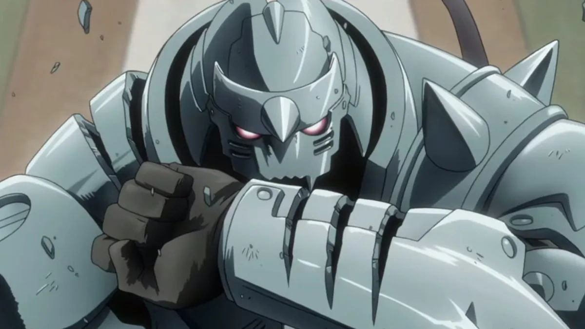 Animated suit of armor boy Alphonse Elric with a scratch on his arm looking into the camera ready to fight in "Full Metal Alchemist: Brotherhood"