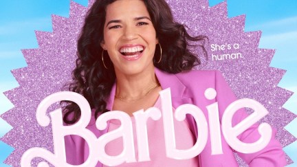 America Ferrera in her 'Barbie' movie poster. She is a Latina with long, wavy dark hair wearing a pink suit jacket over a lighter pink blouse and thin gold hoop earings. She's smiling a big smile as she stands in front of a pink glittery starburst against a blue backdrop. The text on the right reads 