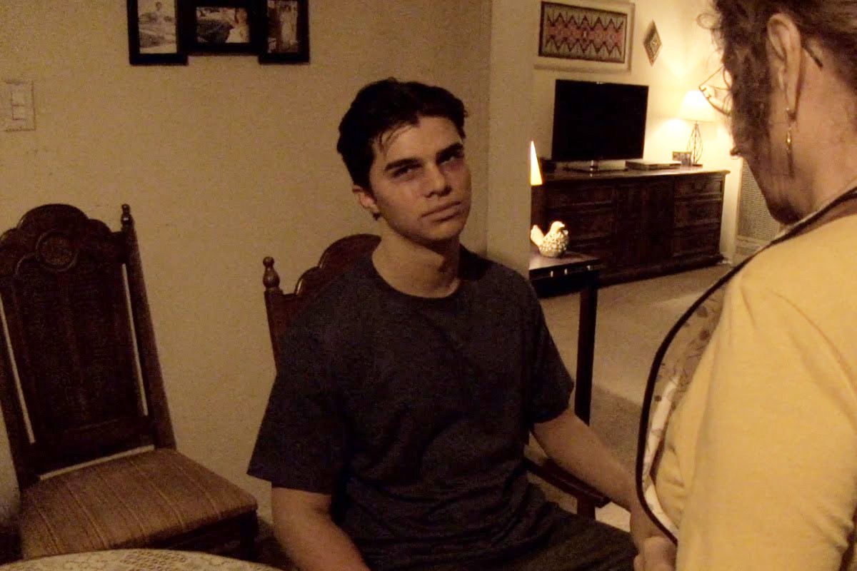 A possessed Jesse Arista (Andrew Jacobs) looking tired of his loved ones trying to help him in Paranormal Activity: The Marked Ones
