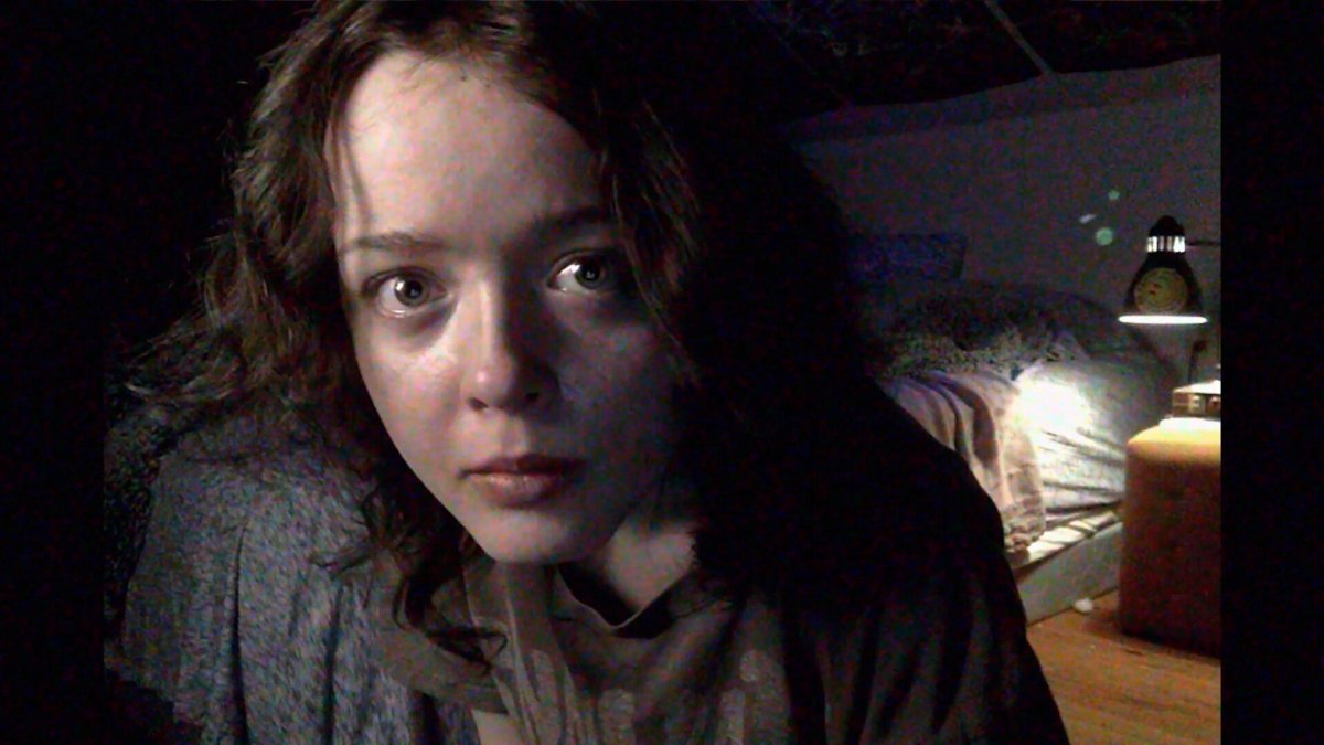 Casey (Anna Cobb) looks into the camera of her laptop computer in ‘We’re All Going to the World’s Fair.’ 