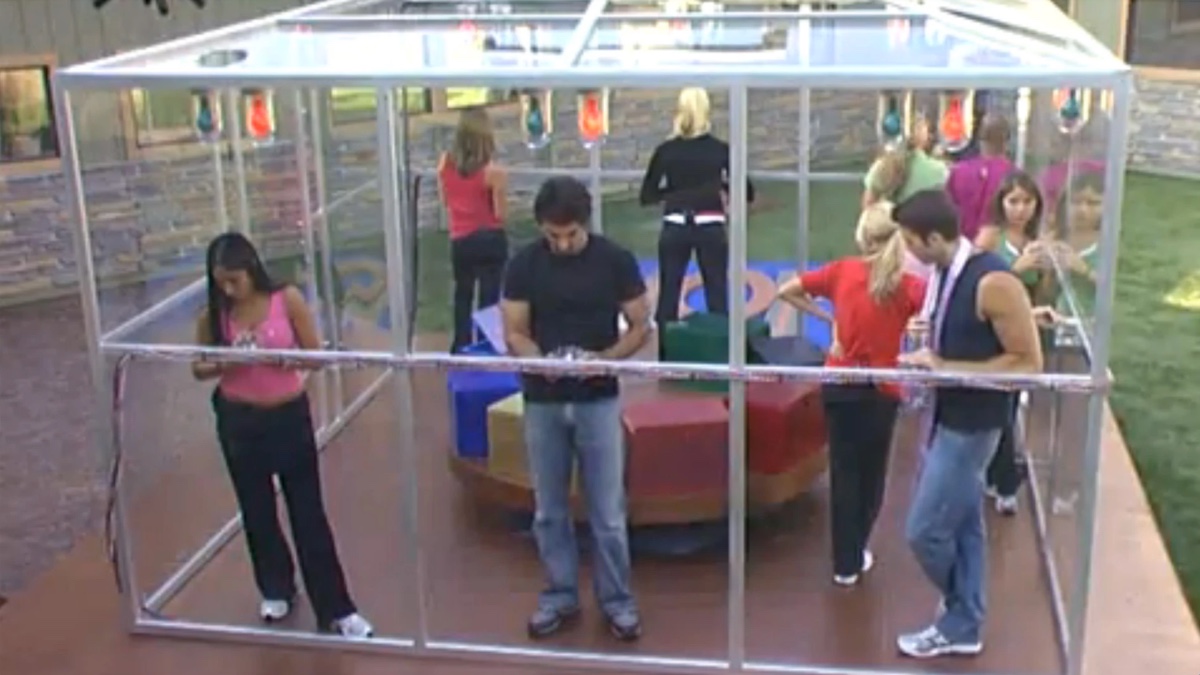 Big Brother 6 Houseguests stand in a glass box and play the "Pressure Cooker" 