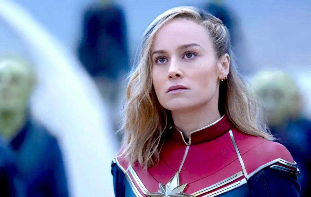 Brie Larson as Carol Danvers/Captain Marvel in The Marvels, with some Skrulls in the background