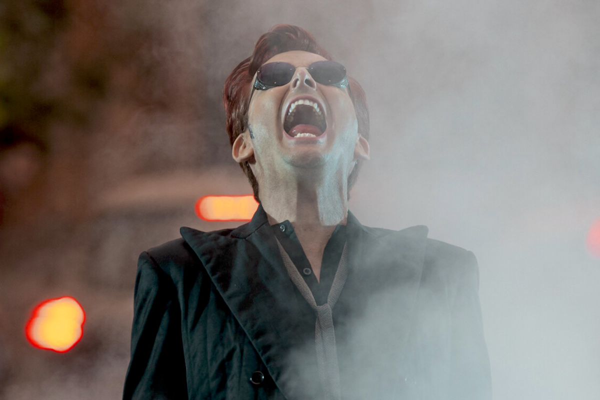 Crowley (David Tennant) is partially obscured by fog as he screams in the middle of a street in 'Good Omens' season 2.