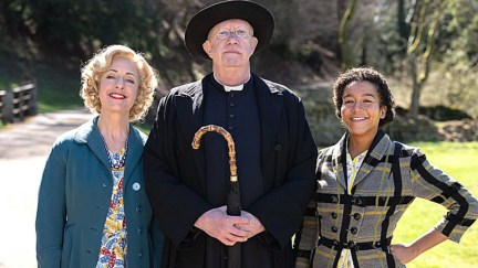 Claudie Blakley as Mrs. Devine, Mark Williams as Father Brown, and Ruby-May Martinwood as Brenda in Father Brown