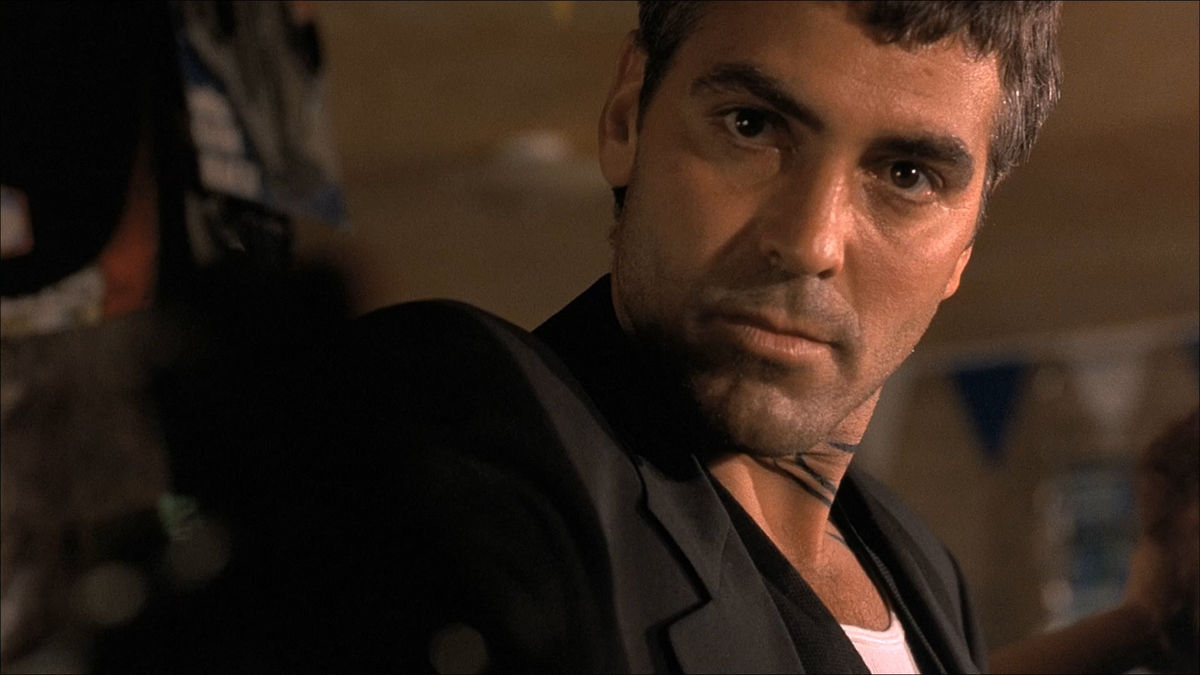 A menacing man named Seth Gecko (George Clooney) with a neck tattoo in 'From Dusk Till Dawn'