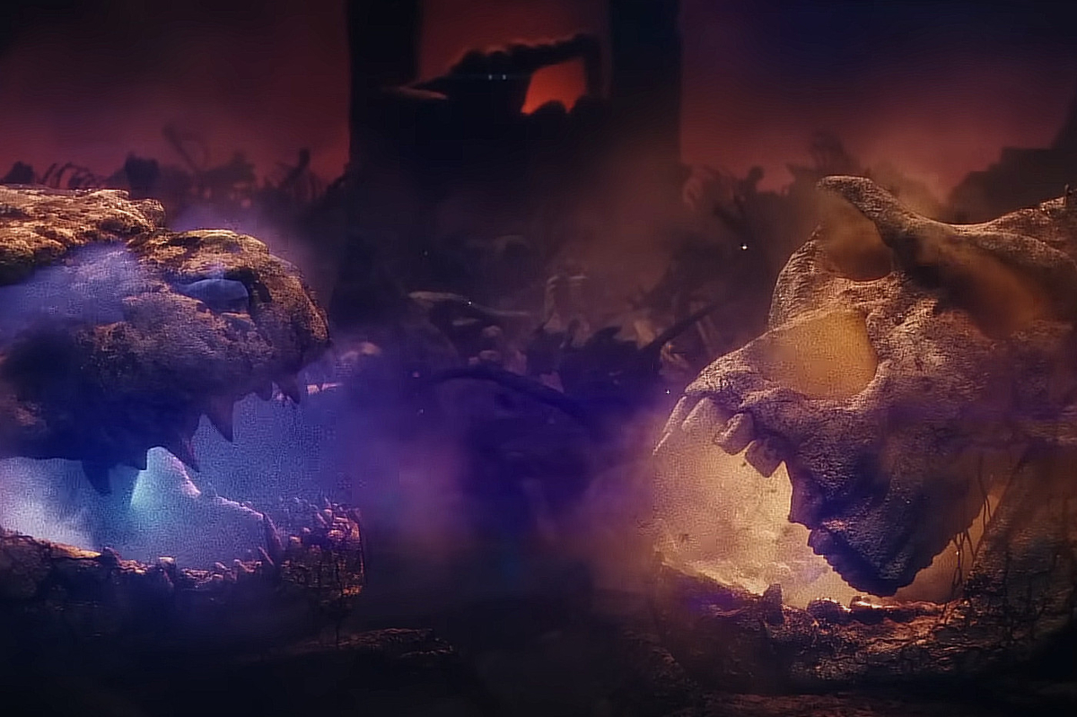 A Godzilla skull faces a Kong Skull in front of a shadowy figure on a throne in the 'Godzilla x Kong: The New Empire' trailer