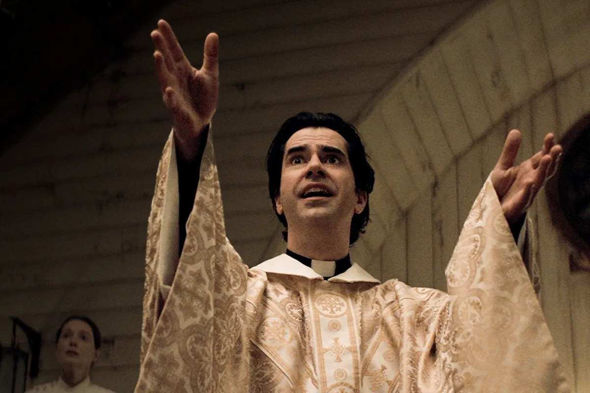 A priest named Monsignor Pruitt (Hamish Linklater) staring in awe in 'Midnight Mass'