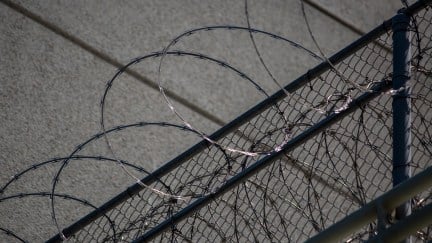 LOS ANGELES, CA - JULY 14: Razor wire is seen on the Metropolitan Detention Center prison as mass arrests by federal immigration authorities, as ordered by the Trump administration, were supposed to begin in major cities across the nation on July 14, 2019 in Los Angeles, California. The U.S. Immigration and Customs Enforcement was expected to be target hundreds of Angelenos for deportation, plus family members and others they encounter and suspect of being undocumented. The city of Los Angeles declared itself a sanctuary city to reflect its policy since the 1970s of not allowing police to help immigration officials because the city wants its immigrant populations to not be afraid to cooperate with police or call in crimes and emergencies. Elected officials and activists have continued to lash out against the raids. (Photo by David McNew/Getty Images)