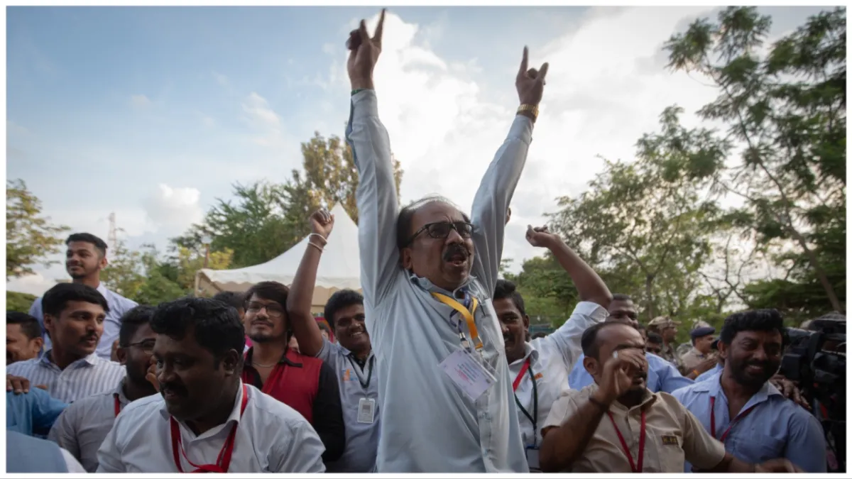 BENGALURU, INDIA - AUGUST 23: Employees of the Indian Space Research Organisation (ISRO) celebrate after the successful landing of Chandrayaan-3 mission on the moon inside the ISRO Telemetry Tracking and Command Network (ISTRAC) facility on August 23, 2023 in Bengaluru, India. India’s indigenously built unmanned Chandrayaan-3 space exploration mission with the 1752 kg lunar lander ‘Vikram’ containing the six-wheeled 26 kg rover ‘Pragyan’ landed near the lunar South Pole making it the fourth country after the United States, the Union of Soviet Socialist Republics (USSR), and China, to achieve this feat. Chandrayaan-3 will conduct in-situ scientific experiments on the lunar surface. (Photo by Abhishek Chinnappa/Getty Images)