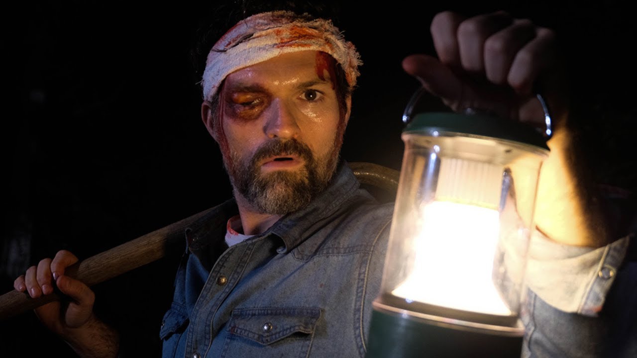 Bruce Ernst (Josh Ruben) sports a wounded eye, a bandaged head, and carries a lantern and a shovel in ‘A Wounded Fawn.’ 