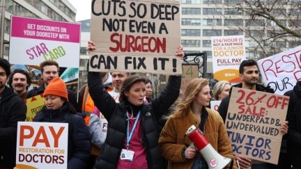Junior doctors and supporters take part in a demonstration outside St Thomas' Hospital, during a strike over pay.