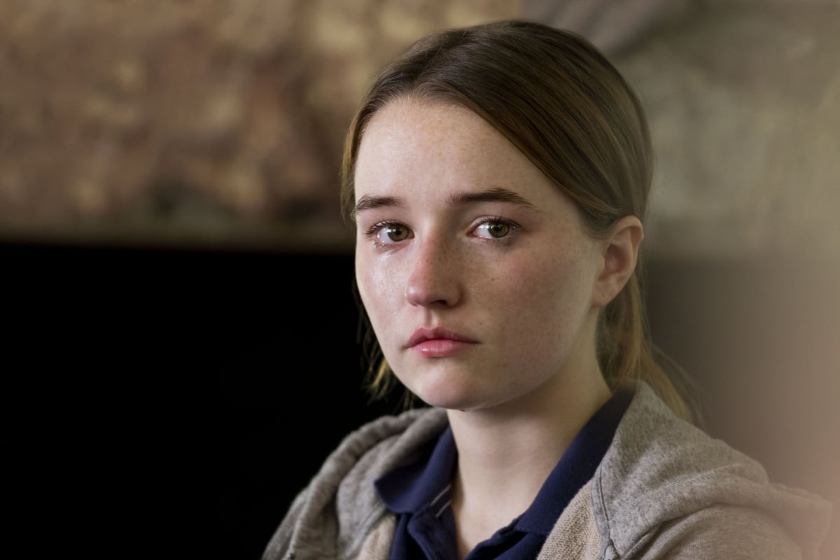 Kaitlyn Dever in the Netflix series 'Unbelievable.' A young woman looks toward the camera. She is upset.