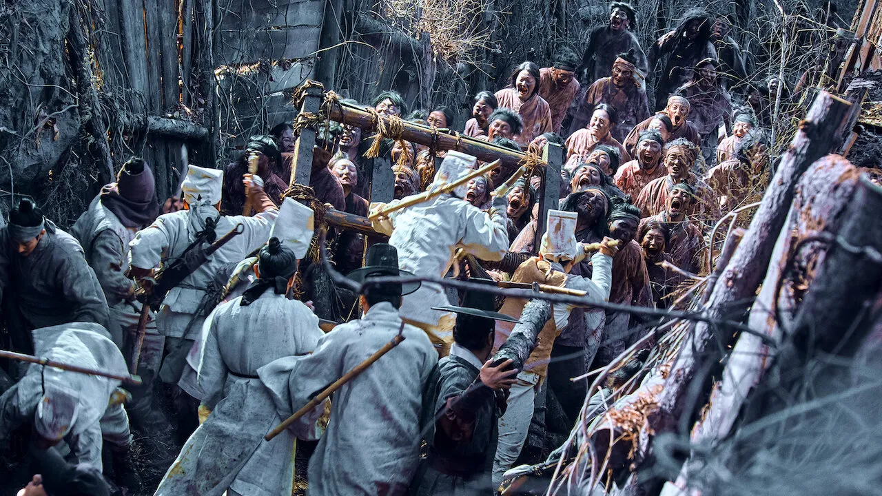 Joseon-era royal guards barricade against a horde of undead South Koreans in 'Kingdom.'