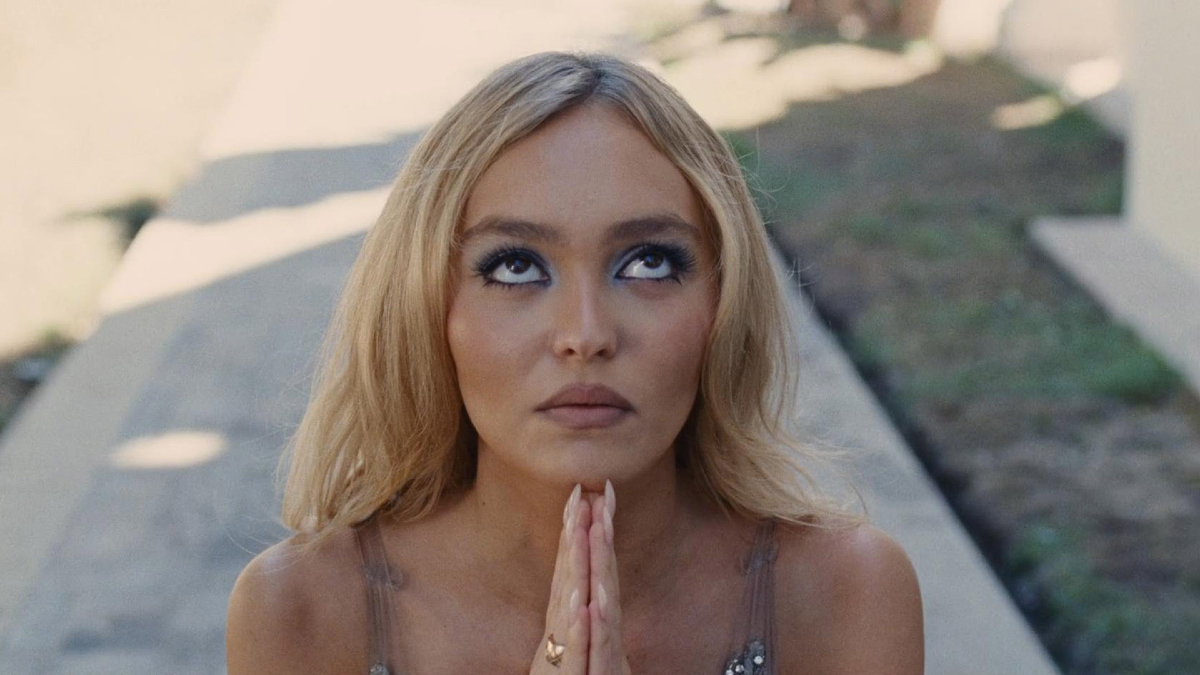 Jocelyn (Lily-Rose Depp) clasps her hands in prayer in 'The Idol'