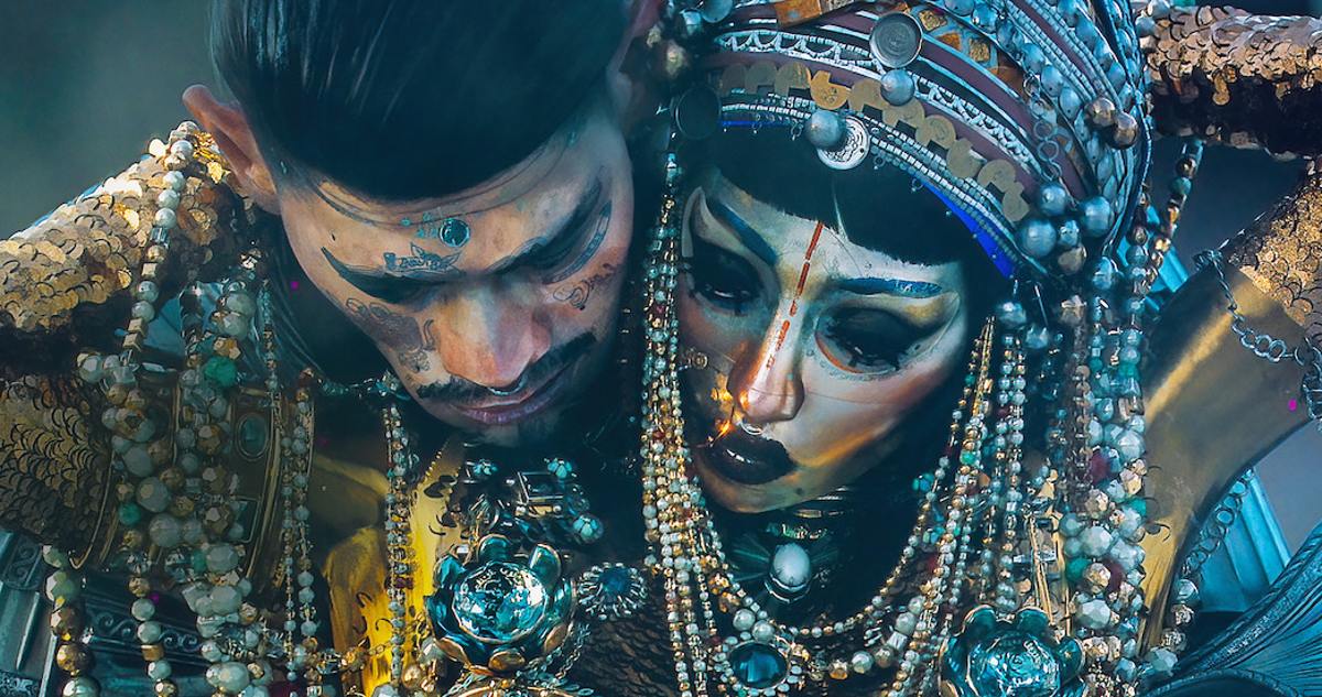 Two people dripping in jewels and gold dance sensually in "Love, Death, and Robots"