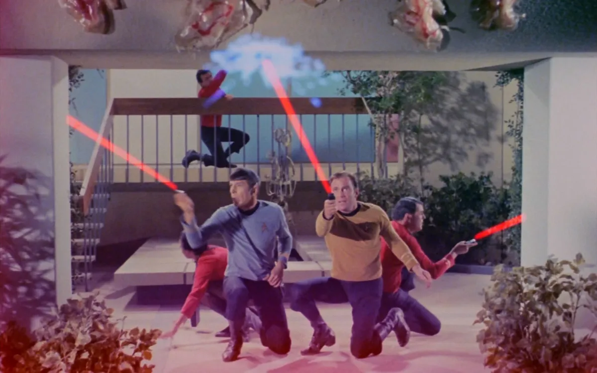 Spock, Kirk, and Scotty fire their phasers at organisms in "Operation -- Annihilate!" in 'Star Trek: The Original Series' 