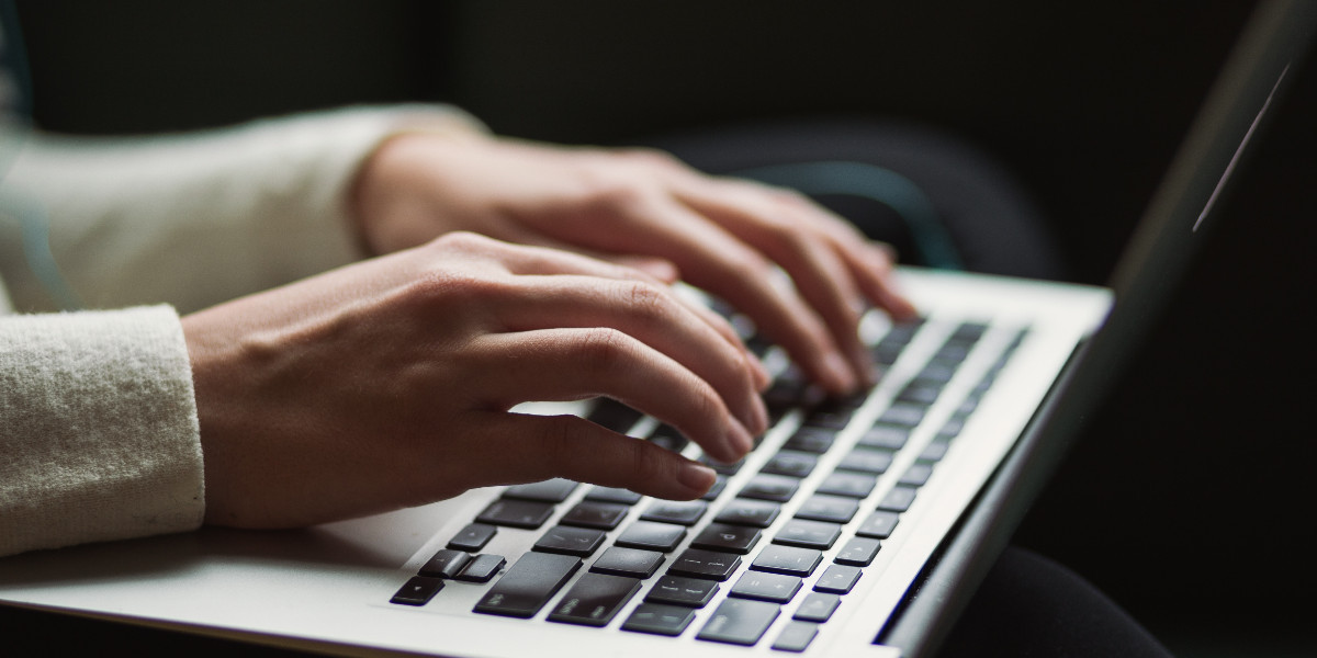 Person typing on a laptop