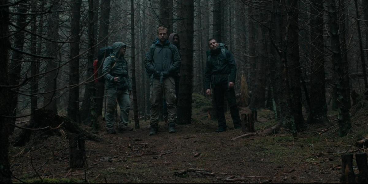 Phil (Arsher Ali), Dom (Sam Troughton), Hutch (Robert James-Collier), and Luke (Rafe Spall) get lost in the woods in 'The Ritual.'