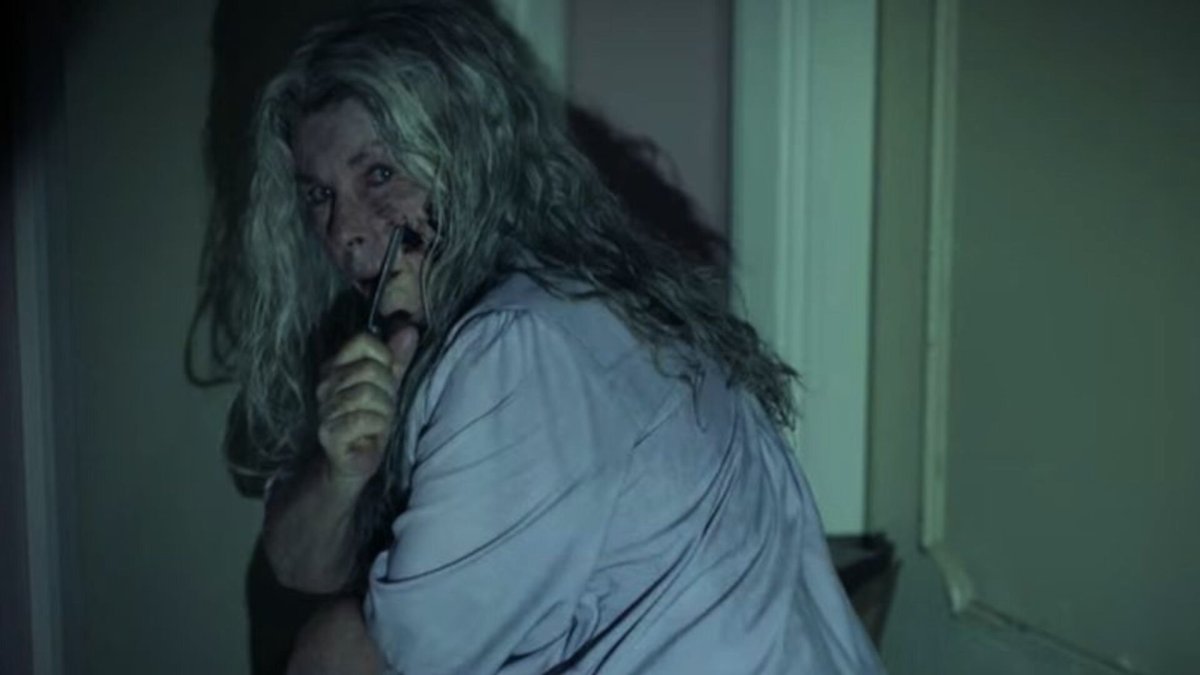 A bloodied Edna (Robyn Nevin) brandishes a small weapon in ‘Relic.’