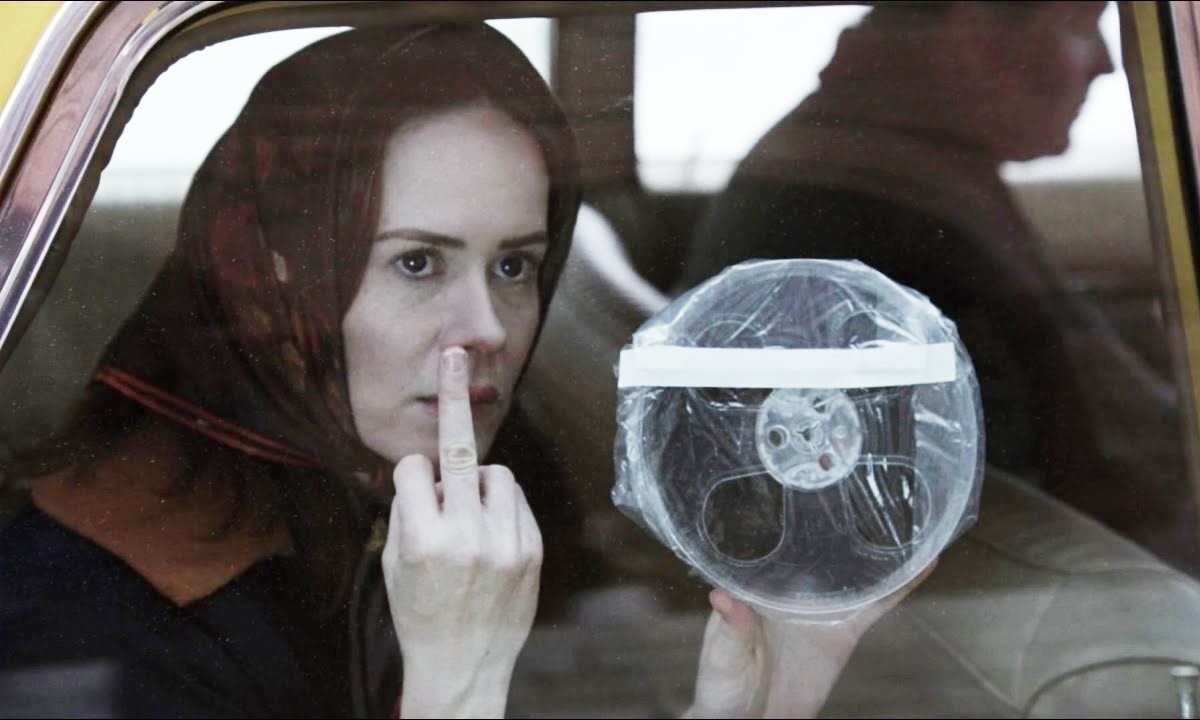 Lana Winters (Sarah Paulson) giving the middle finger while holding a tape in "American Horror Story: Asylum"