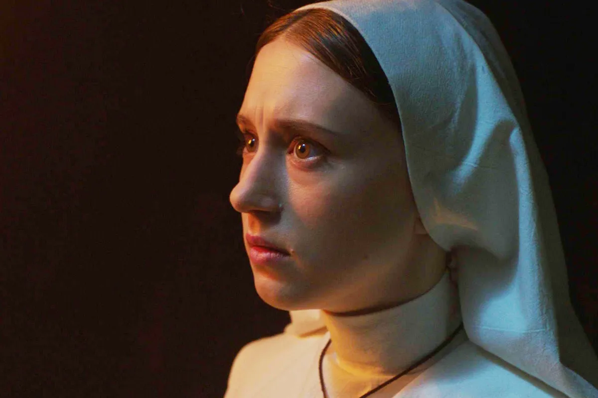 Taissa Farmiga in her nun uniform in "The Nun" looking scarily away from the camera