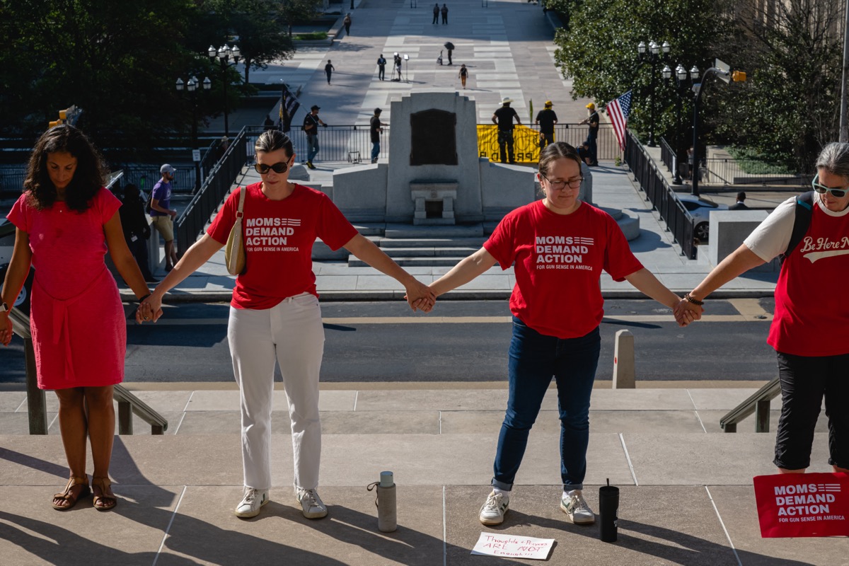 NASHVILLE, TENNESSEE - AUGUST 21: Gun reform activists join hands and surround the Tennessee State Capitol in prayer ahead of a special session on August 21, 2023 in Nashville, Tennessee. Republican Tennessee Governor Bill Lee called for the special legislation session on public safety in response to public outcry after the The Covenant School mass shooting, where three children and three staff were killed. (Photo by Jon Cherry/Getty Images)