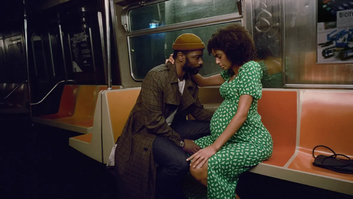 A couple sitting on a train in 'The Changeling'