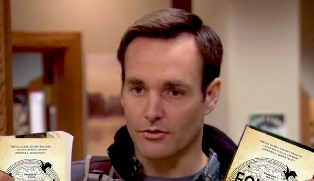 Will Forte in Parks and Rec holding Photoshopped Fourth Wing books.