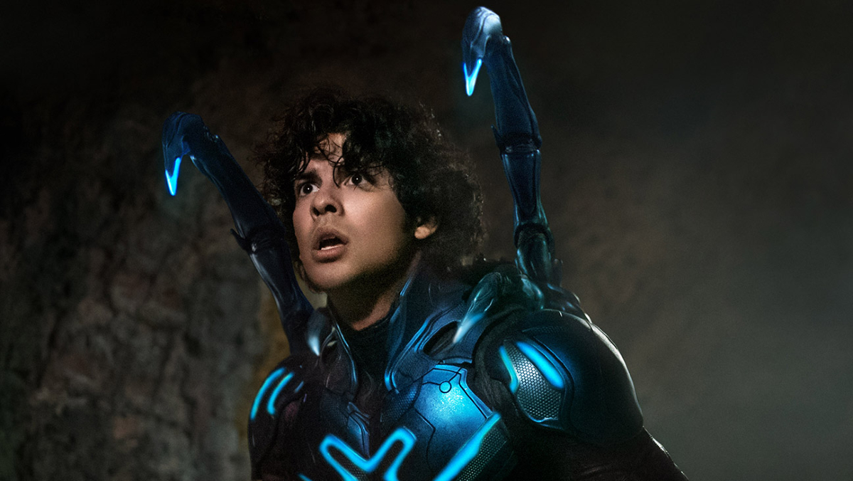 Jaime Reyes (Xolo Maridueña) wears a beetle-like superhero suit with mech appendages in 'Blue Beetle'