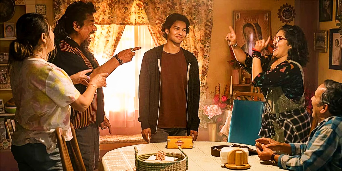 Xolo Mariduena as Jaime Reyes with the Reyes family in Blue Beetle